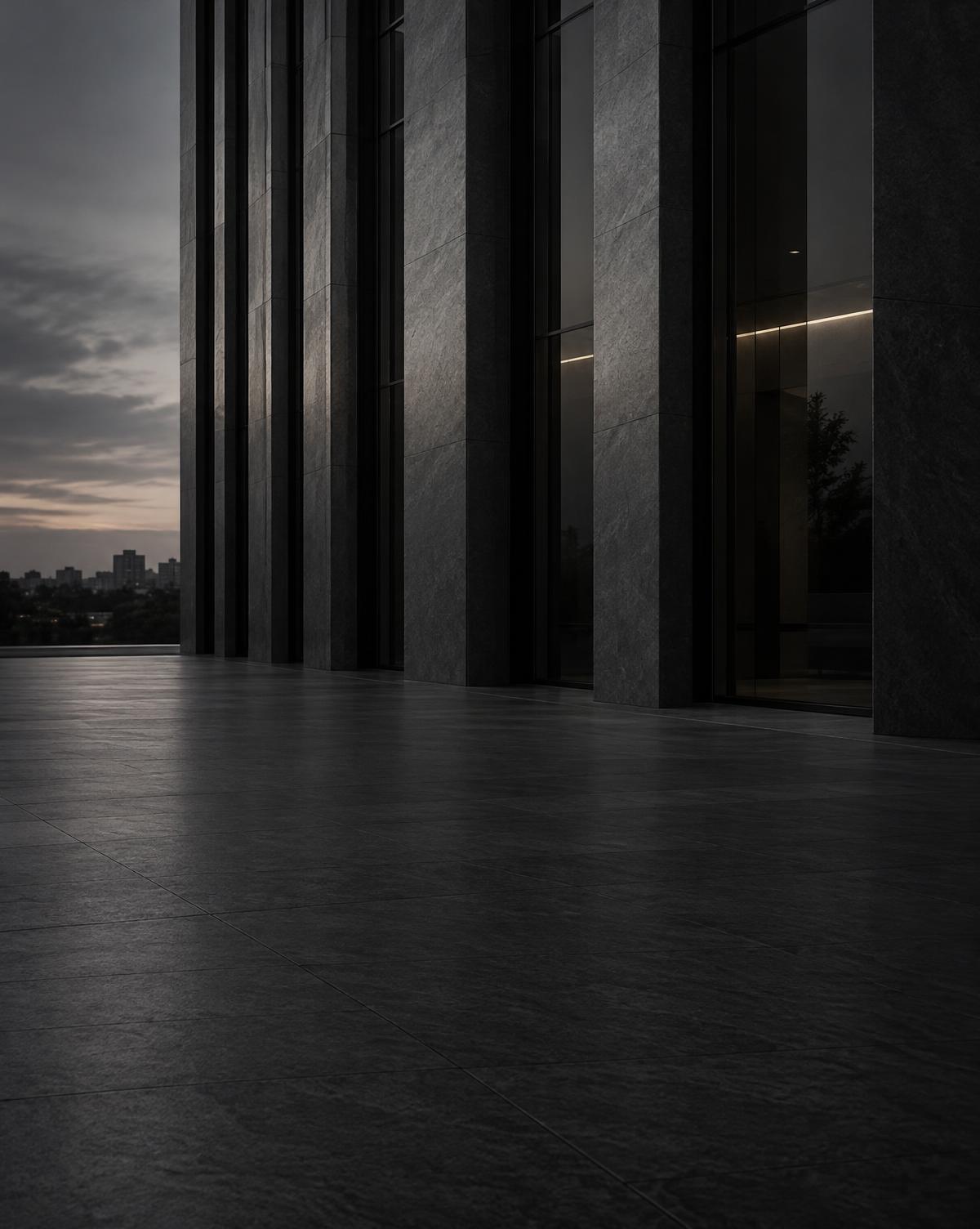 Modern stone and glass building facade at dusk